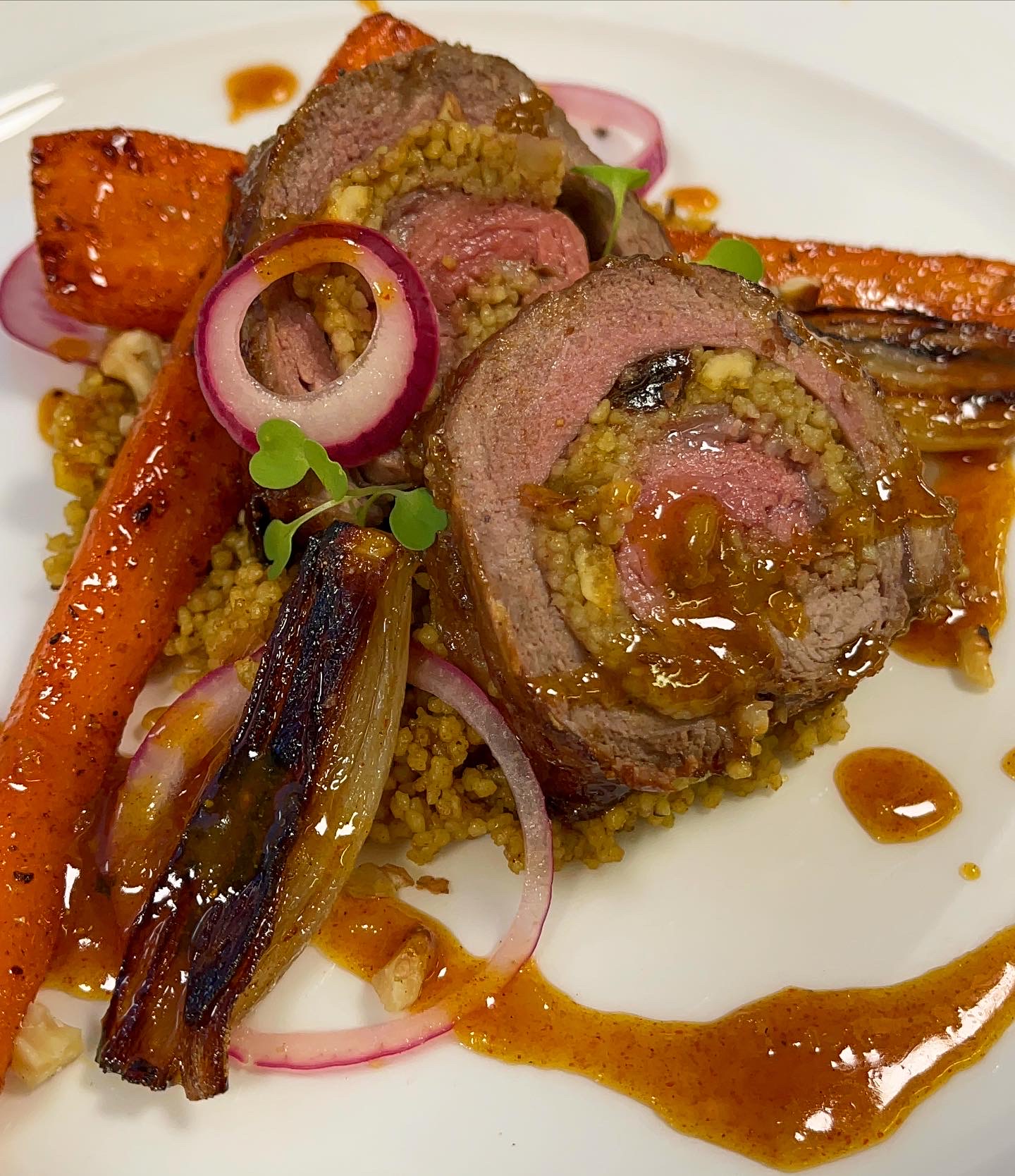 Stuffed Medium rare Lamb steak with Moroccan couscous